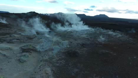 Amazing-drone-shot-over-sulfur-vapors-in-Namafjall-Hverarond,-Geysers,-mud-pits